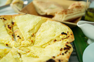 Georgian traditional flatbread - khachapuri or hachapuri with double cheese.