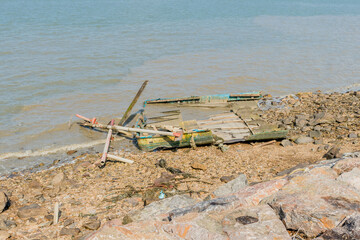 Remains of crashed boat in water
