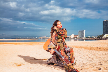 guitar woman on the beach