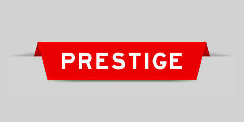 Red color inserted label with word prestige on gray background