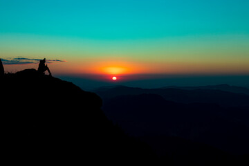 Fototapeta na wymiar A person admiring the Sunset