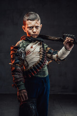 Little stalker with pistol on his shoulder in dark background