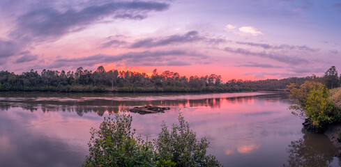 Beautiful Panoramic Riverside Sunrise with Cloud Reflections