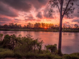 Beautiful Riverside Sunset with Cloud Reflections