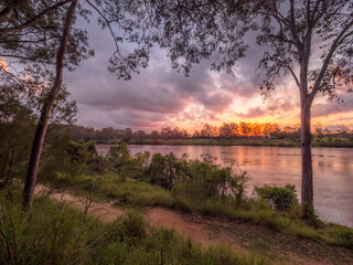 Beautiful Riverside Sunset with Cloud Reflections