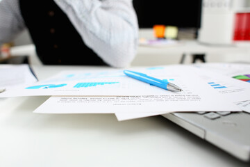 Silver pen lying on important paper at table