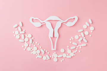 Concept of Gynecology therapy, woman health, place for text. Vaginal suppositoriy, tablets on pink background. Treatment of vaginal infections from candidiasis, thrush, sexually transmitted infections - obrazy, fototapety, plakaty