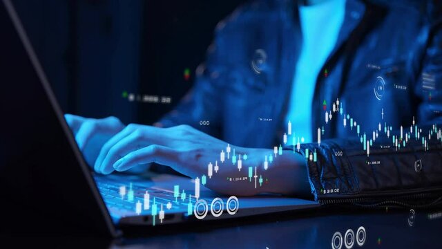 Smart businessman hand close up NFT financial data on laptop futuristic stock chart graphic, Business investor stock exchange market and crypto currency digital technology ideas background 
