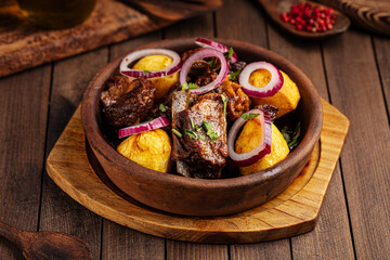 Georgian national dish ojahuri with meat on wooden background