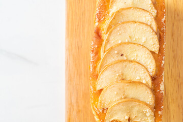 apple loaf crumbled on wood board