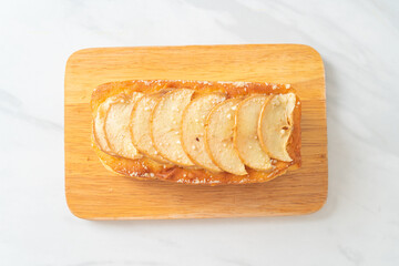 apple loaf crumbled on wood board