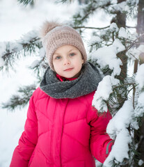 Child in winter. A little girl,  playing in the winter outside.