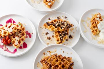 Croffle (a compound word of croissant and waffle) is a dessert where croissant raw paper is baked in a waffle pan and eaten with ice cream or maple syrup