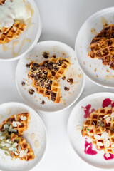 Croffle (a compound word of croissant and waffle) is a dessert where croissant raw paper is baked in a waffle pan and eaten with ice cream or maple syrup