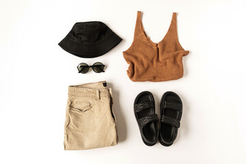Feminine summer aesthetic fashion clothes composition with panama hat, slippers, sunglasses, top,...