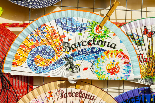 Traditional Spanish fan with cartoons about the city of Barcelona.