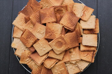 lots of delicious cinnamon waffles on a tray