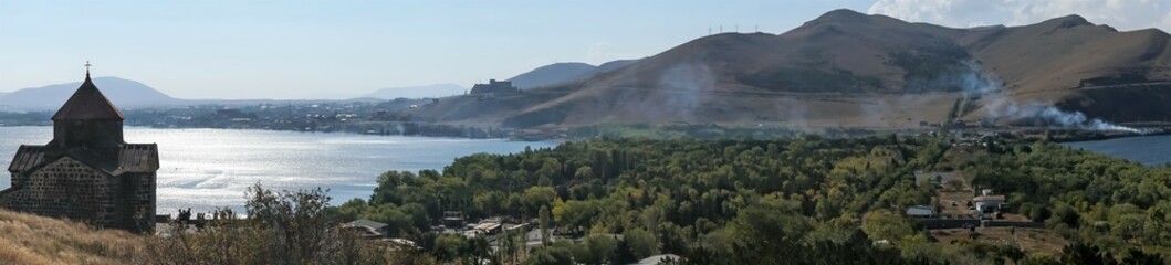 Armenia, Lake Sevan, September 2021. Panorama of the lake with a Christian temple.