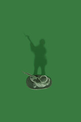 Plastic Toy Soldier on a Green Background