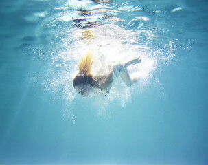 underwater shooting of a girl with loose hair