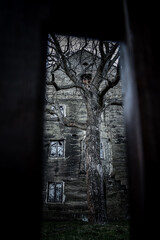 A view through the fence on An historical haunted building from stone known as the House of Alchemist, according to folk chronicles a sorcerer lived here, Czech republic.