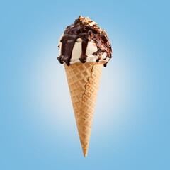 Chocolate nuts ice cream cone on blue background.