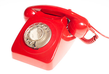 red retro telephone on white background