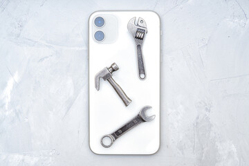 Set of work tools on top of a smartphone