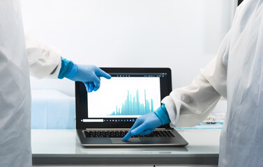 Specialist doctors fighting against corona virus outbreak - Science team examining pandemic cases graphs - Healthcare and covid-19 emergency concept