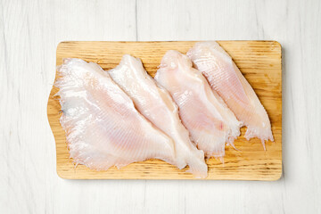 Overhead view of raw fresh stingray wings ready for frying