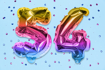 Rainbow foil balloon number, digit fifty four on a blue background with sequins. Birthday greeting card with inscription 54. Top view. Numerical digit. Celebration event, template.