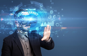 Businessman looking through VR glasses