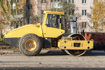 Heavy duty vibratory road roller for asphalt concrete works and road repairs. Heavy machinery when repairing asphalt pavement.