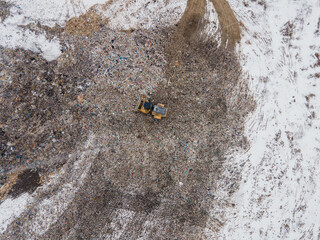 Loading rock mass into a truck. Excavator at work. Mining. flying drone. view from above. mine coal. miner's day