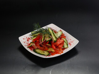 Vegetable salad with tomato and cucumbers