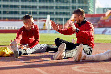 Obraz premium Group of athletes stretching together