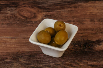 Green pickled olives in the bowl