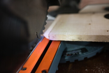 Equipment in a carpentry workshop. carpentry sawing with a circular saw for wood. workshop at home. Craft. Wood processing process. Installation for sawing boards.