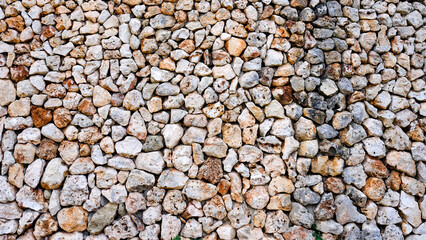 drywall texture. white and red interlocking stones. Menorca, Spain