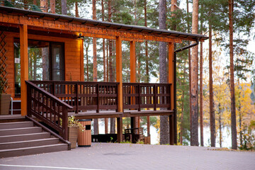 a building in the forest. attic with a view of the lake. forest in autumn