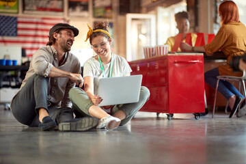 Happy employees informaly chatting together