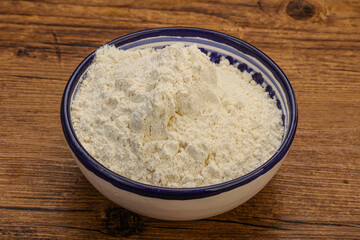 Wheat flour heap in the bowl