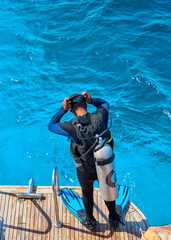 diver swims on the sea