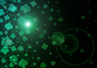 Green bokeh pattern of playing cards symbols.