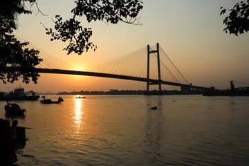Fototapeta na wymiar sunset over the river Ganga or Ganges in kolkata