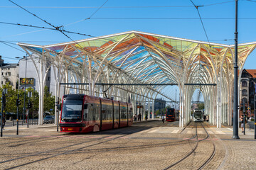 trams leave at the modern main tram station in downtown Lodz - obrazy, fototapety, plakaty