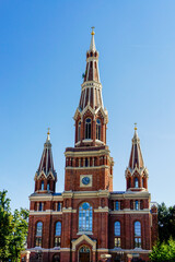 Fototapeta na wymiar historic red brick church in the old city center of Lodz