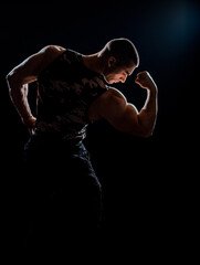 Obraz na płótnie Canvas Powerful strong man with muscular bodybuilder