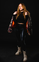 Young casual woman style portrait isolated over dark background