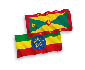 Fototapeta premium National vector fabric wave flags of Grenada and Ethiopia isolated on white background. 1 to 2 proportion.